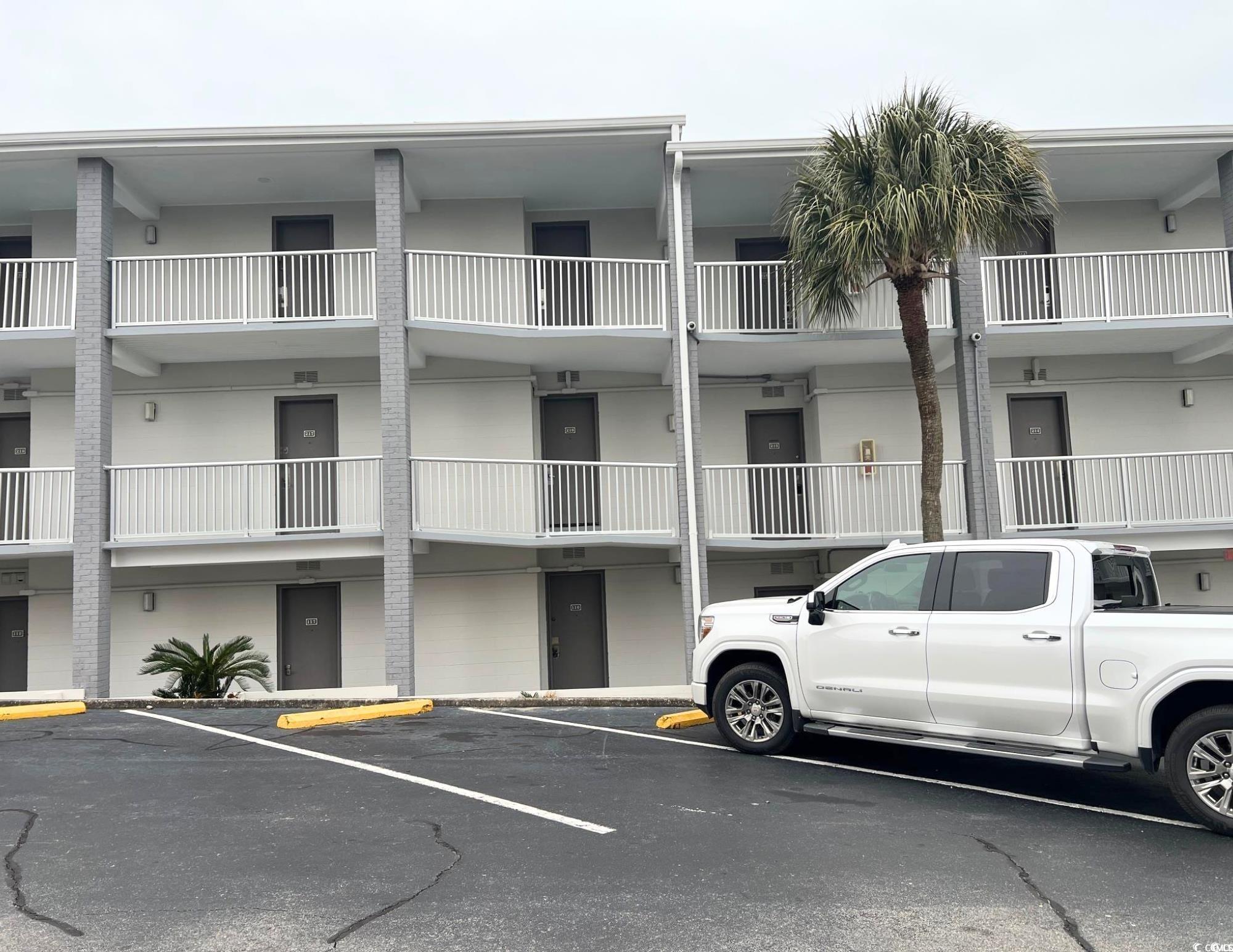 Image 4: View of property featuring uncovered parking Image 4: View of property featuring uncovered parking