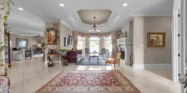 Image 2: Entryway featuring ornamental molding, a chandelie