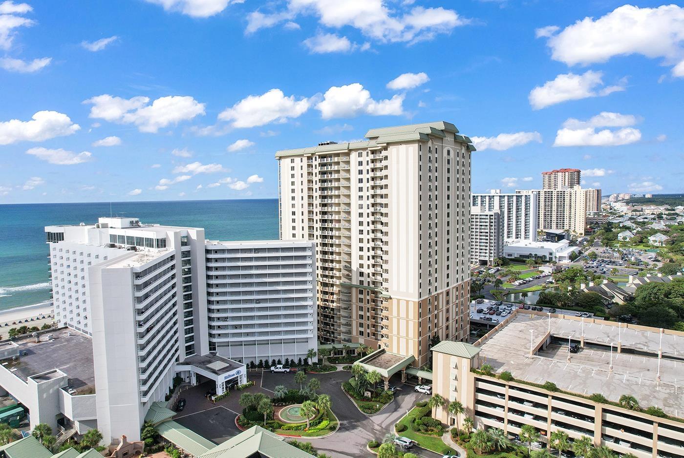 Image 2: Royale Palms is the higher building next to the Hi