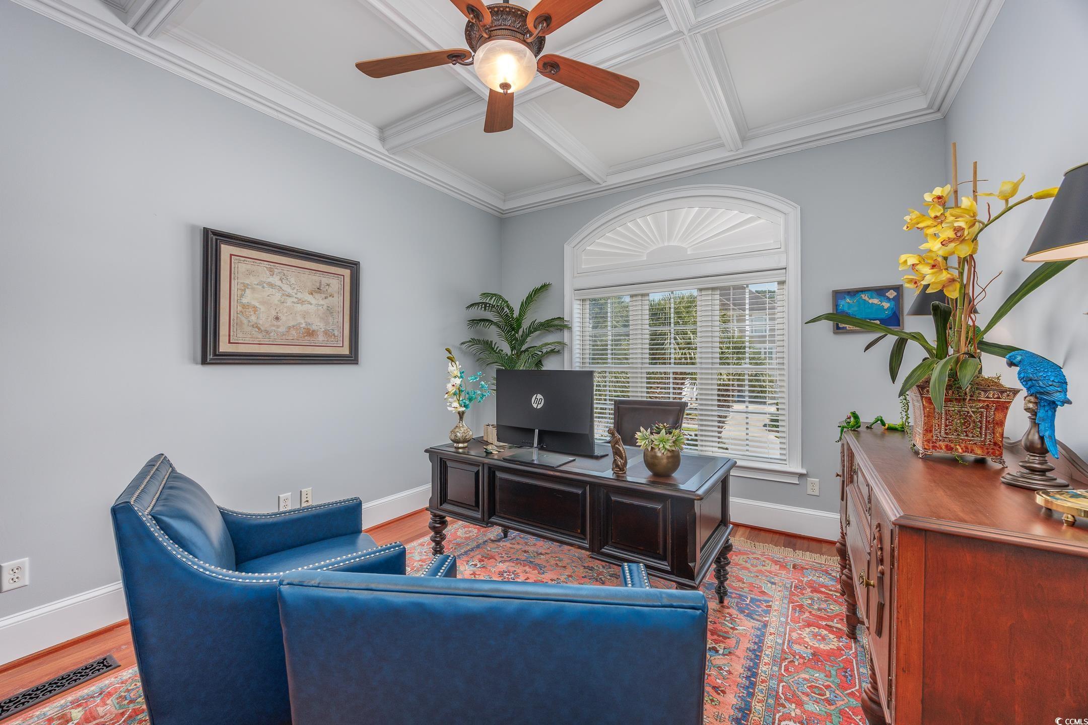Image 4: Office area with coffered ceiling, wood finished f