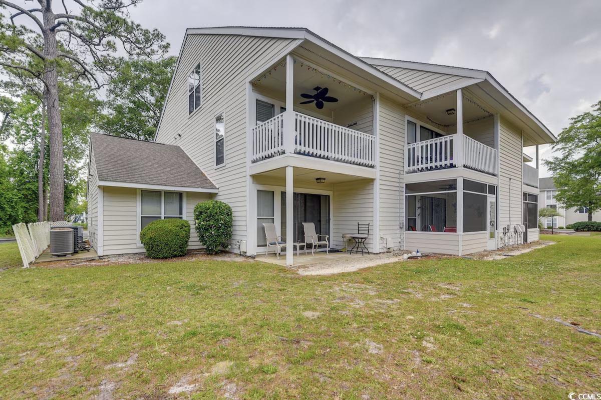 Image 2: Back of house featuring a ceiling fan, a balcony,