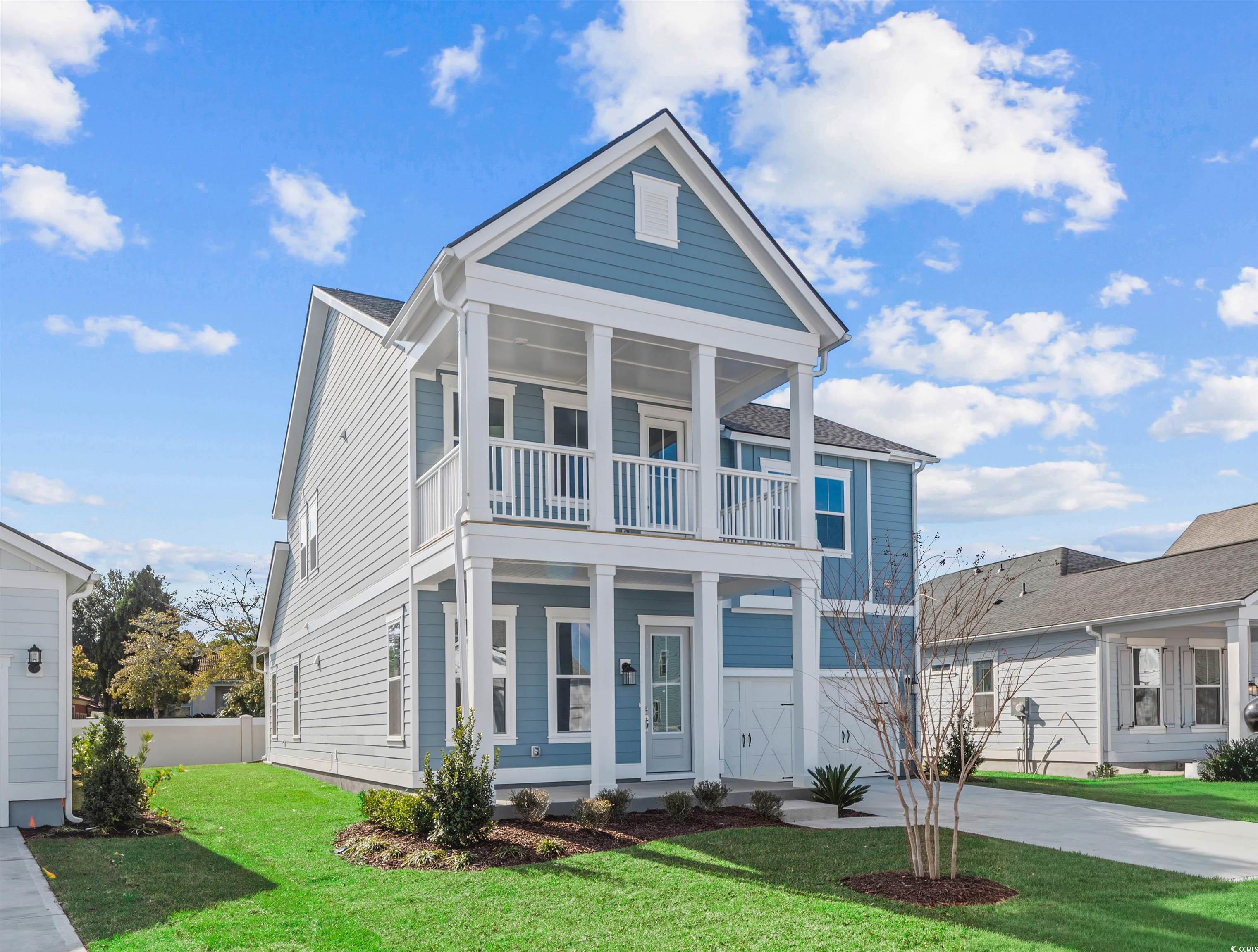 Image 2: View of front of property with a front lawn, a por Image 2: View of front of property with a front lawn, a por