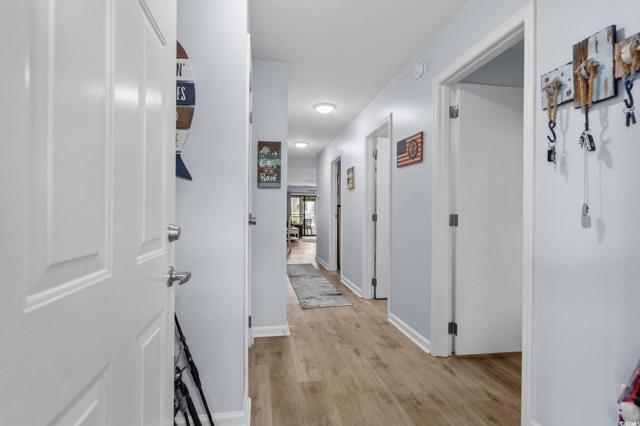 Image 3: Corridor featuring light wood-style floors and bas Image 3: Corridor featuring light wood-style floors and bas