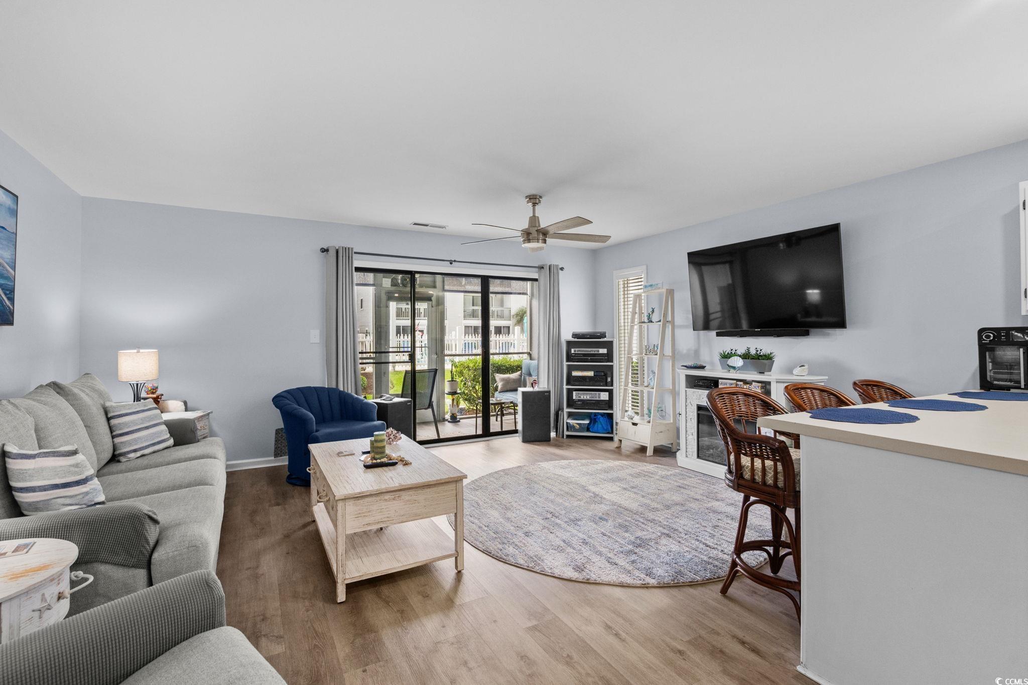 Image 4: Living room featuring light wood-style floors and Image 4: Living room featuring light wood-style floors and