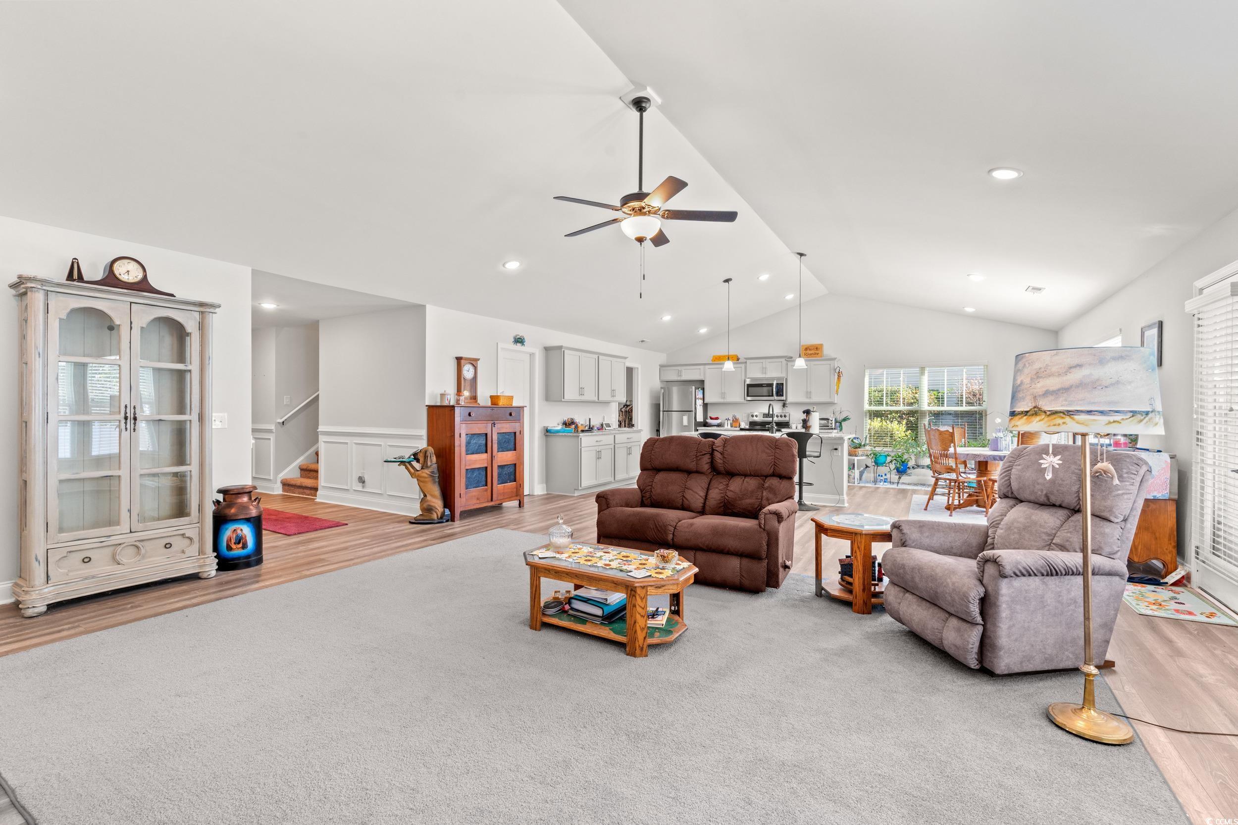 Image 4: Living room featuring lofted ceiling, wood finishe Image 4: Living room featuring lofted ceiling, wood finishe
