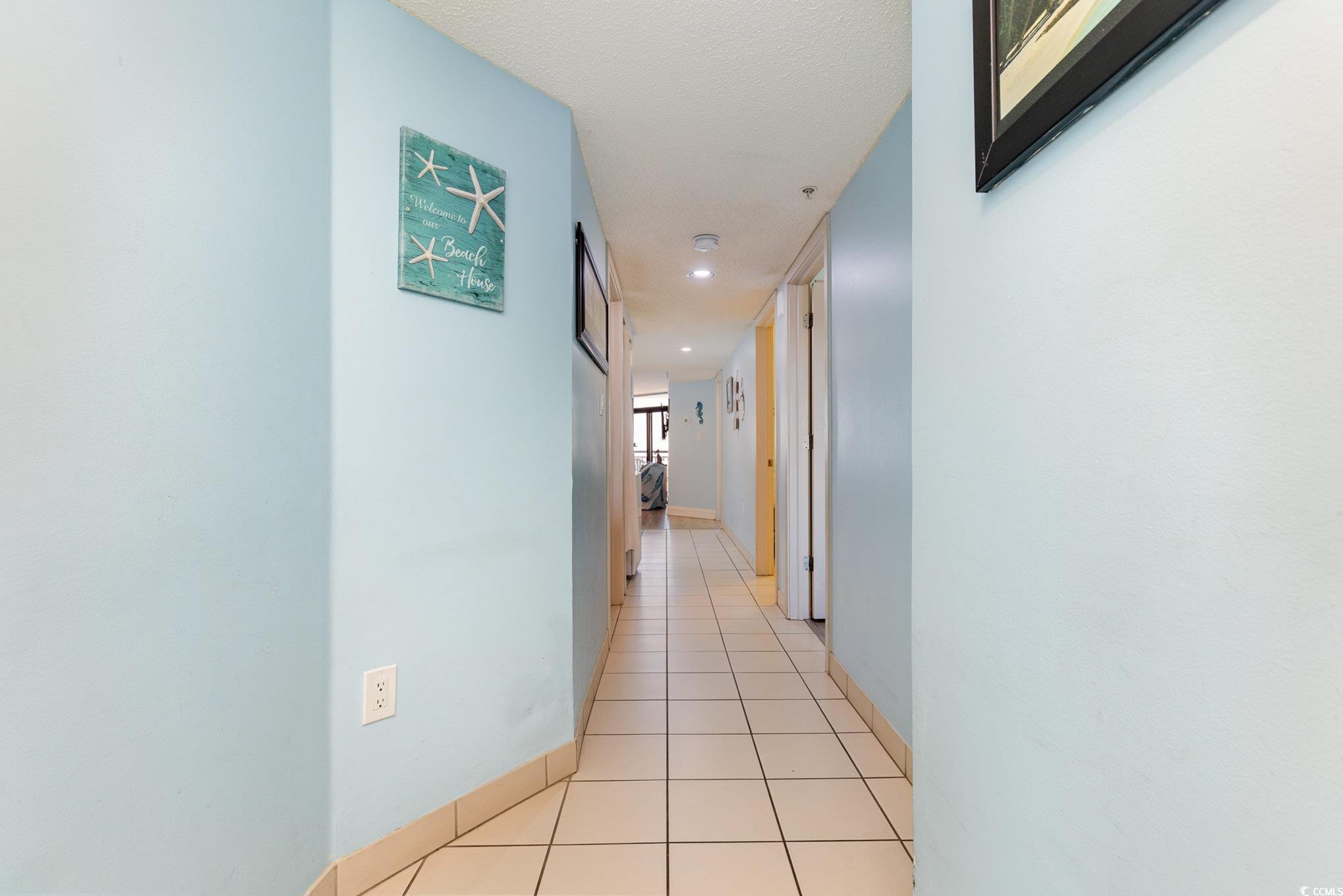Image 3: Hallway with light tile patterned floors Image 3: Hallway with light tile patterned floors