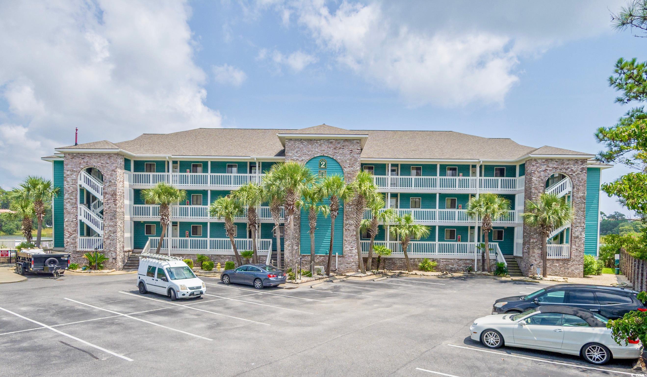 Image 1: View of apartment building / complex with uncovere Image 1: View of apartment building / complex with uncovere