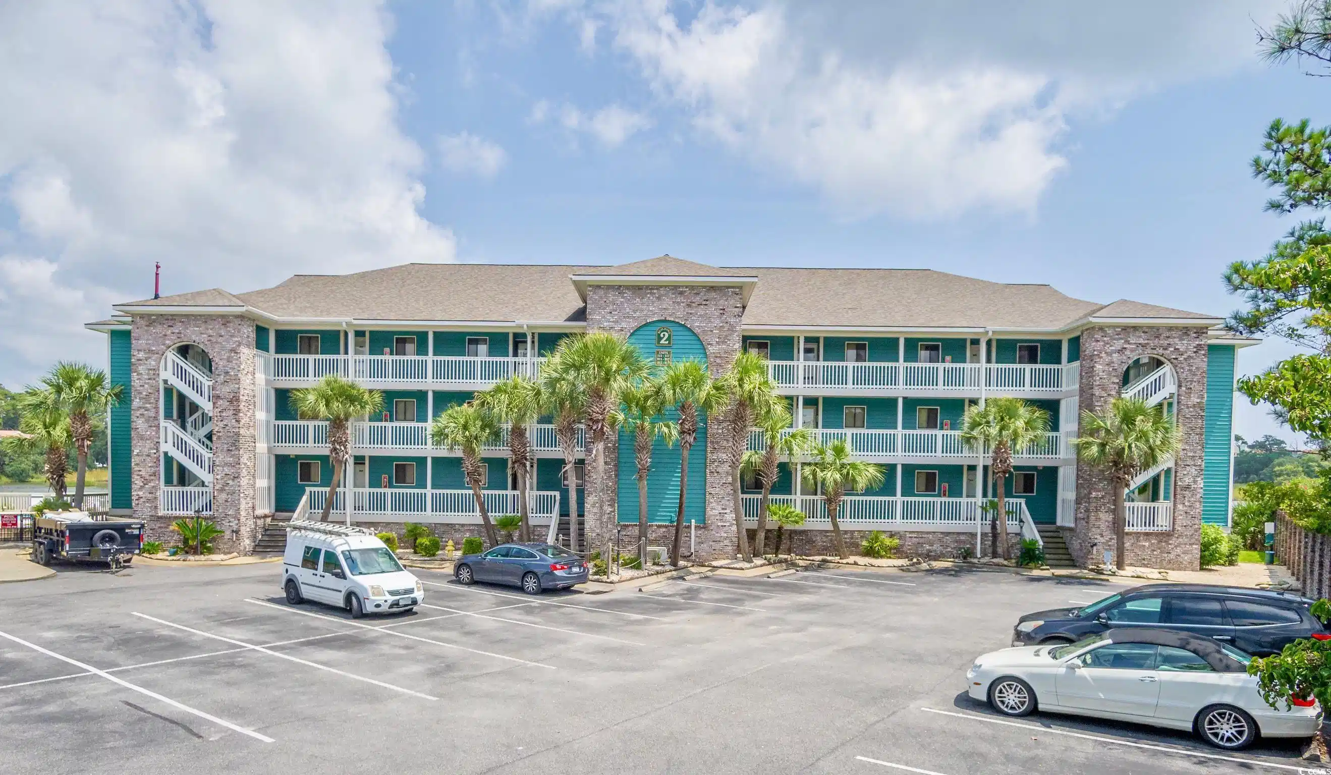 Image 1: View of apartment building / complex with uncovere Image 1: View of apartment building / complex with uncovere