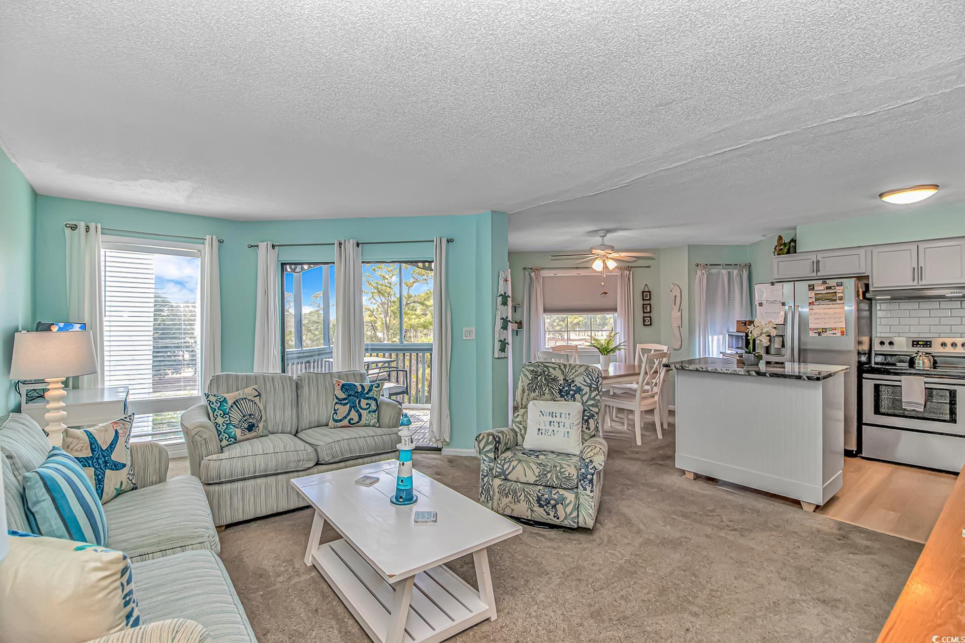 Image 4: Living area featuring healthy amount of natural li Image 4: Living area featuring healthy amount of natural li