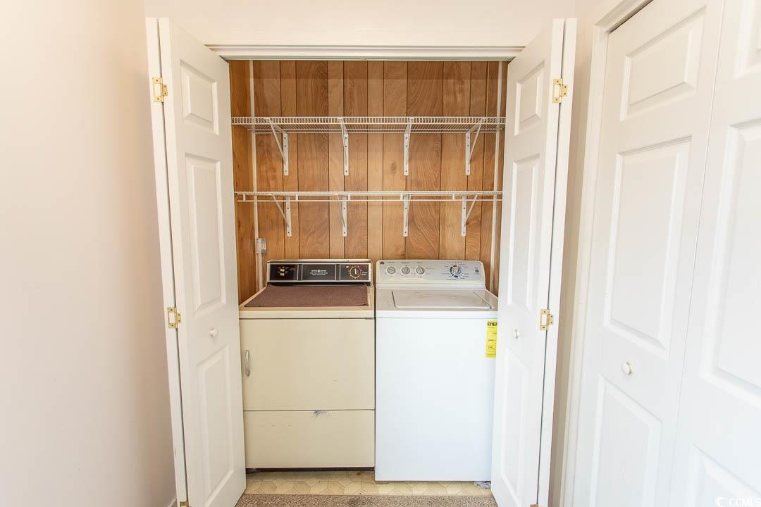 Image 3: Laundry room featuring washing machine and clothes Image 3: Laundry room featuring washing machine and clothes