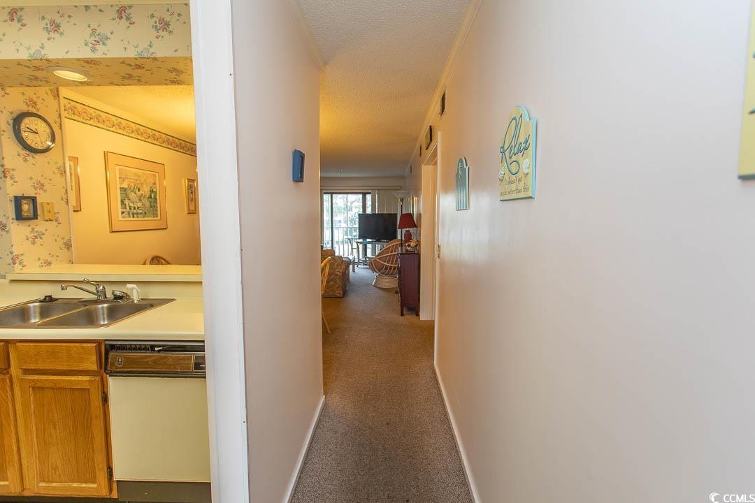 Image 4: Corridor with a sink, baseboards, wallpapered wall Image 4: Corridor with a sink, baseboards, wallpapered wall