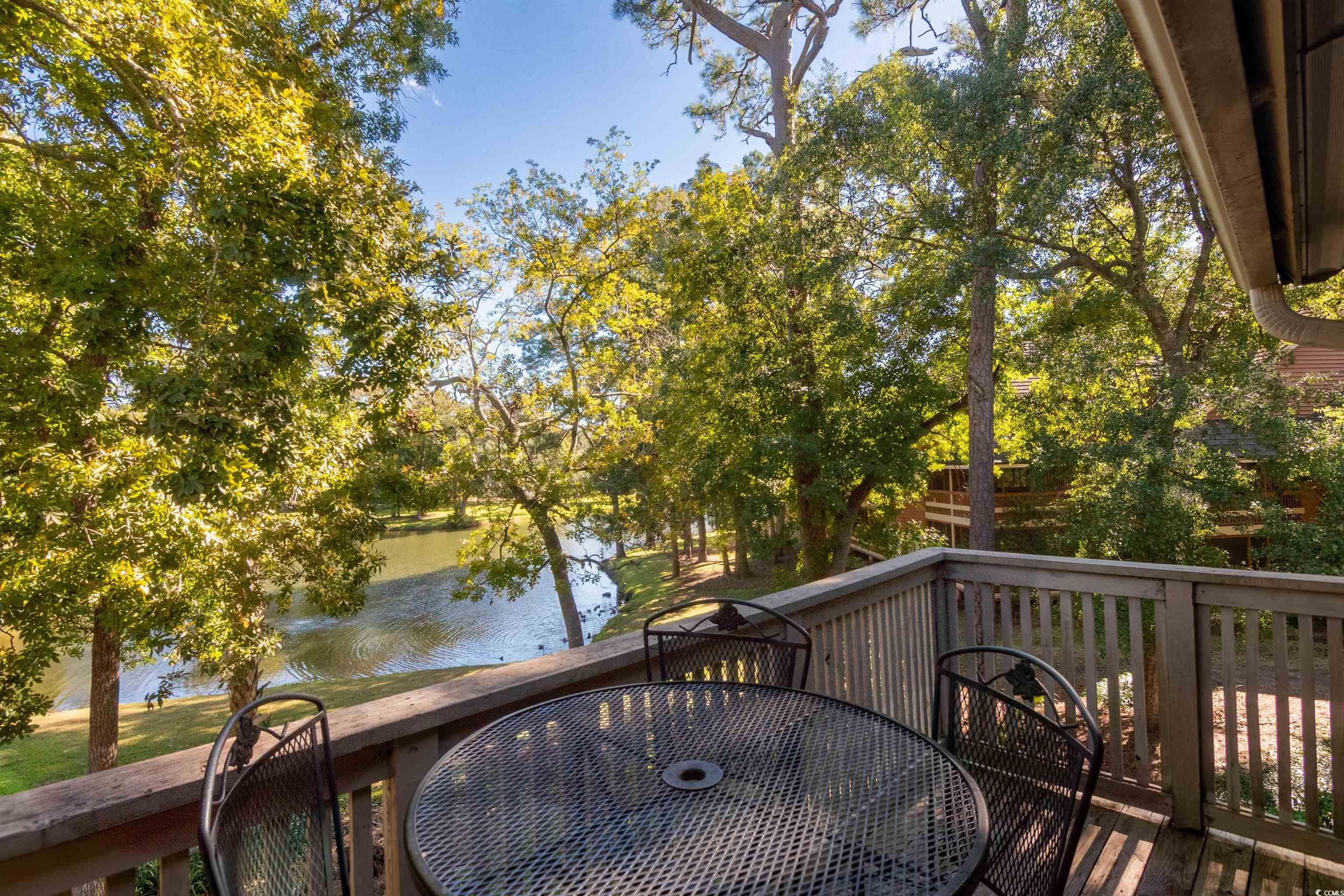 Image 2: Balcony featuring a water view and outdoor dining Image 2: Balcony featuring a water view and outdoor dining
