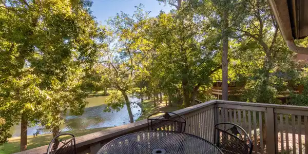 Image 2: Balcony featuring a water view and outdoor dining Image 2: Balcony featuring a water view and outdoor dining