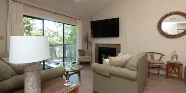 Image 4: Living area with lofted ceiling, a tiled fireplace Image 4: Living area with lofted ceiling, a tiled fireplace