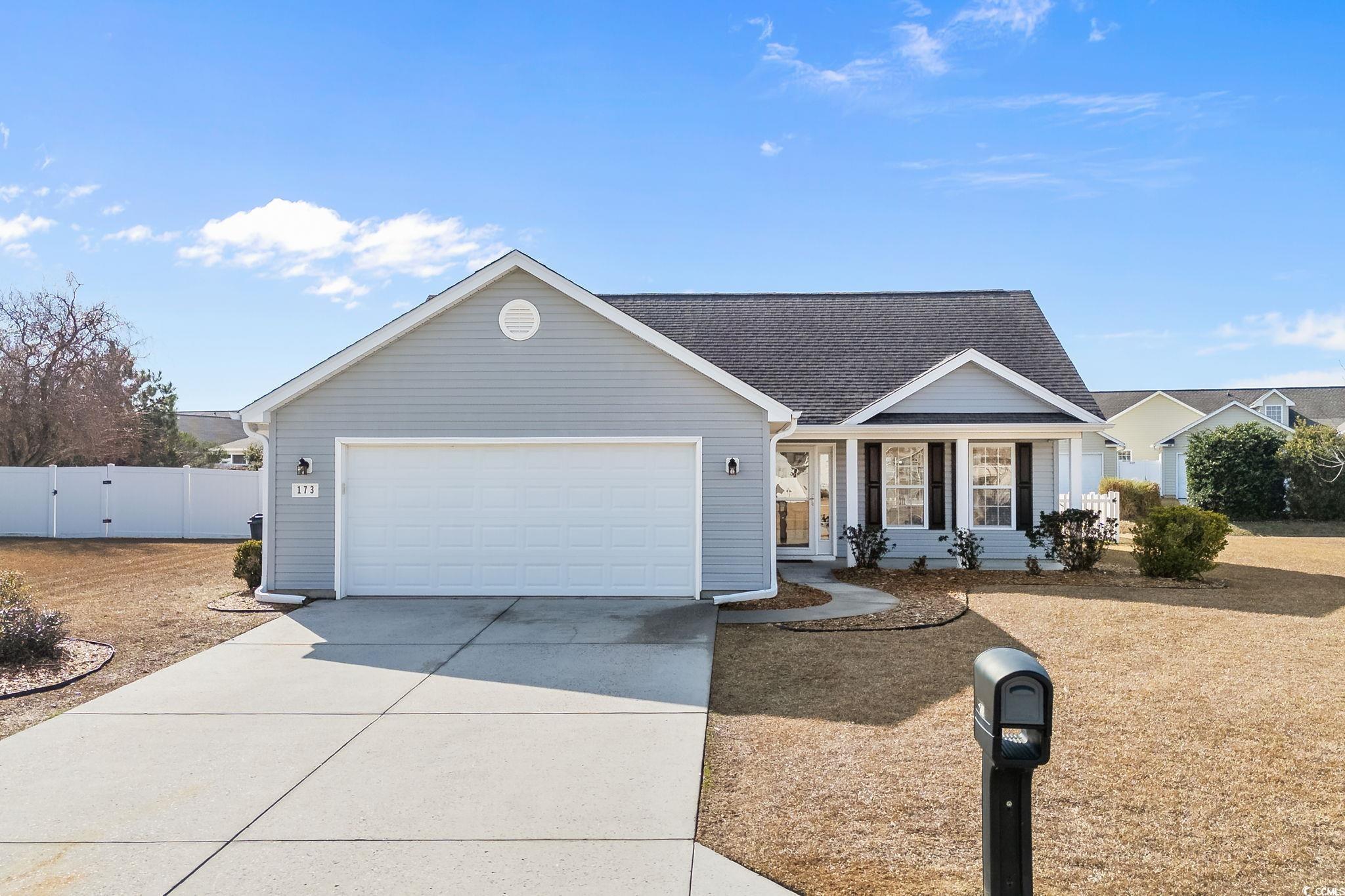 Image 1: Single story home featuring concrete driveway, a g Image 1: Single story home featuring concrete driveway, a g
