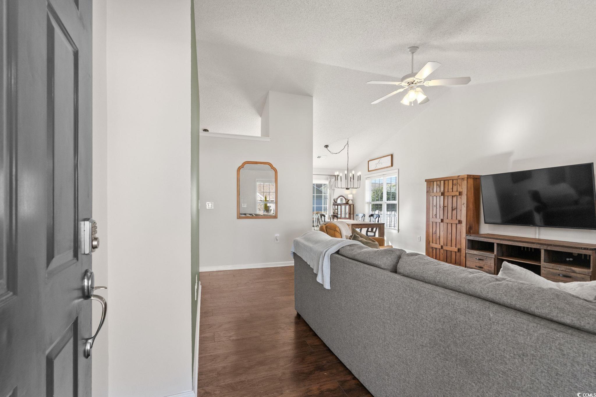Image 2: Living area with vaulted ceiling, dark wood finish Image 2: Living area with vaulted ceiling, dark wood finish