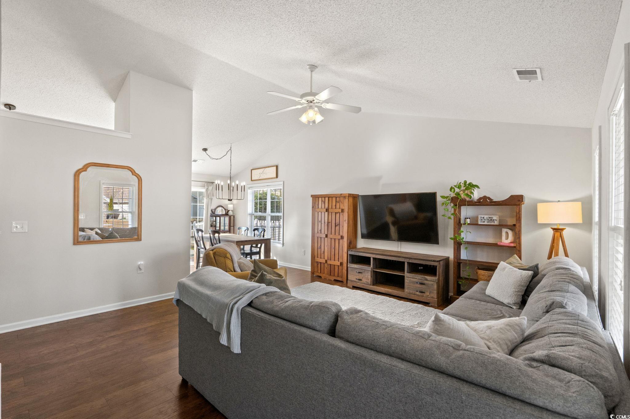 Image 3: Living room featuring vaulted ceiling, dark wood-s Image 3: Living room featuring vaulted ceiling, dark wood-s