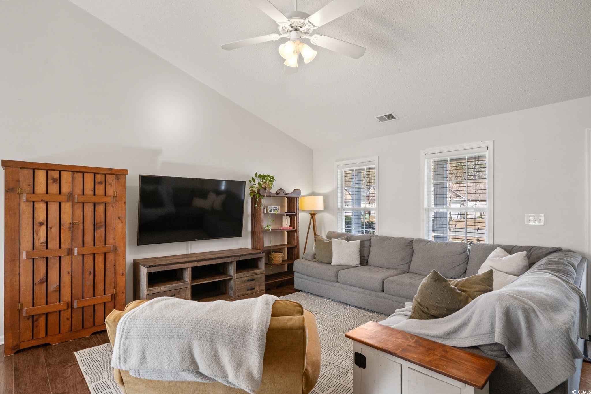 Image 4: Living room featuring lofted ceiling, wood finishe Image 4: Living room featuring lofted ceiling, wood finishe