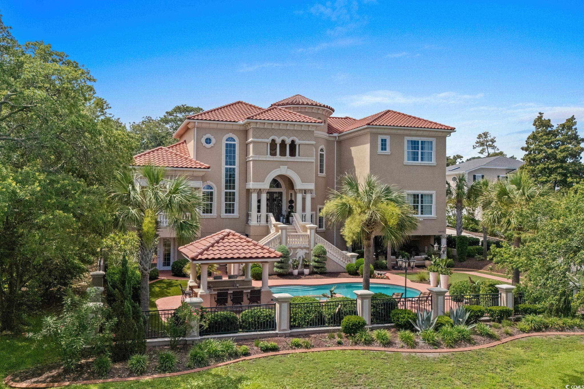 Image 3: View of front of home featuring a gazebo, a tiled