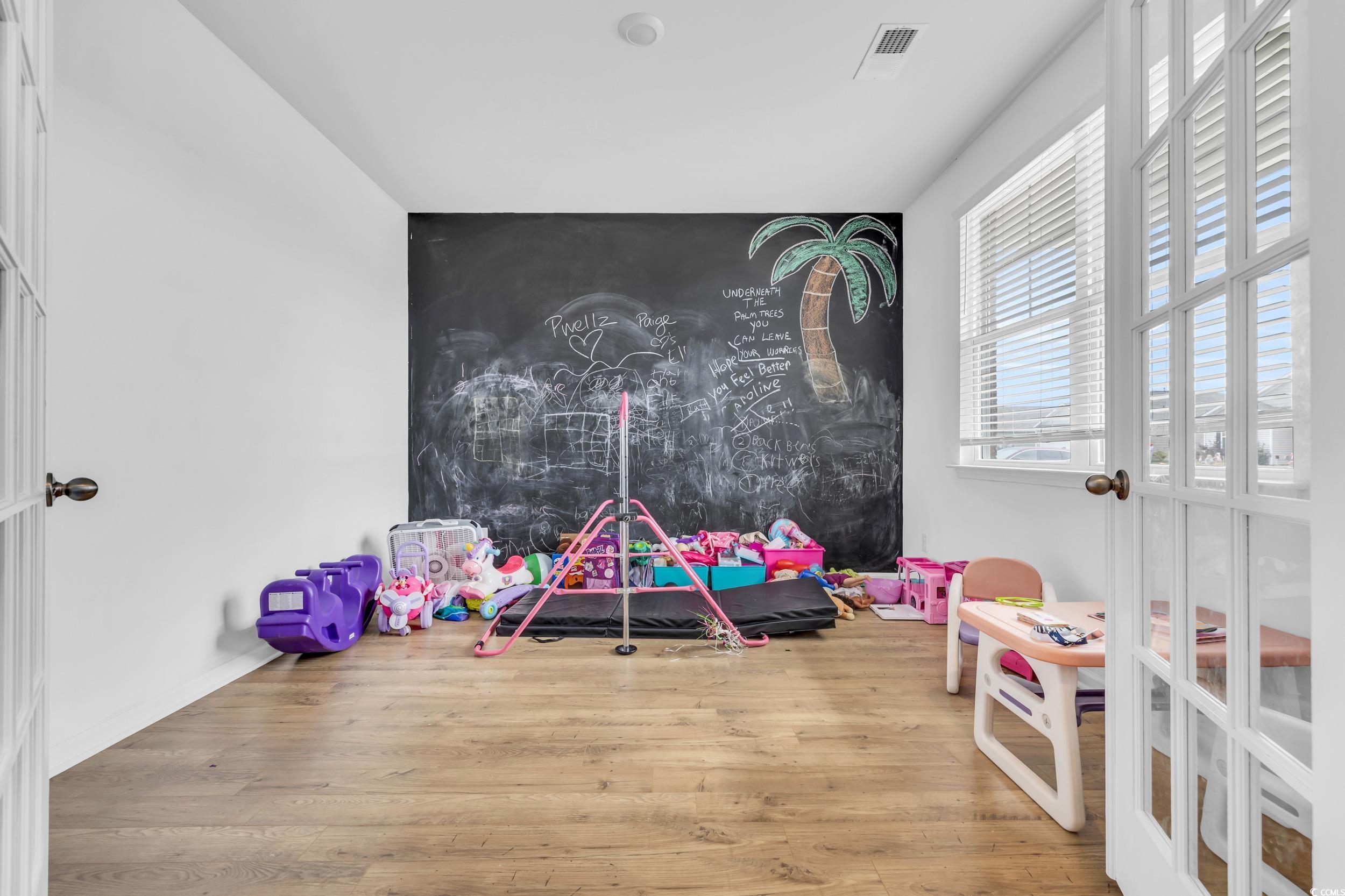 Image 4: Playroom featuring wood finished floors and an acc
