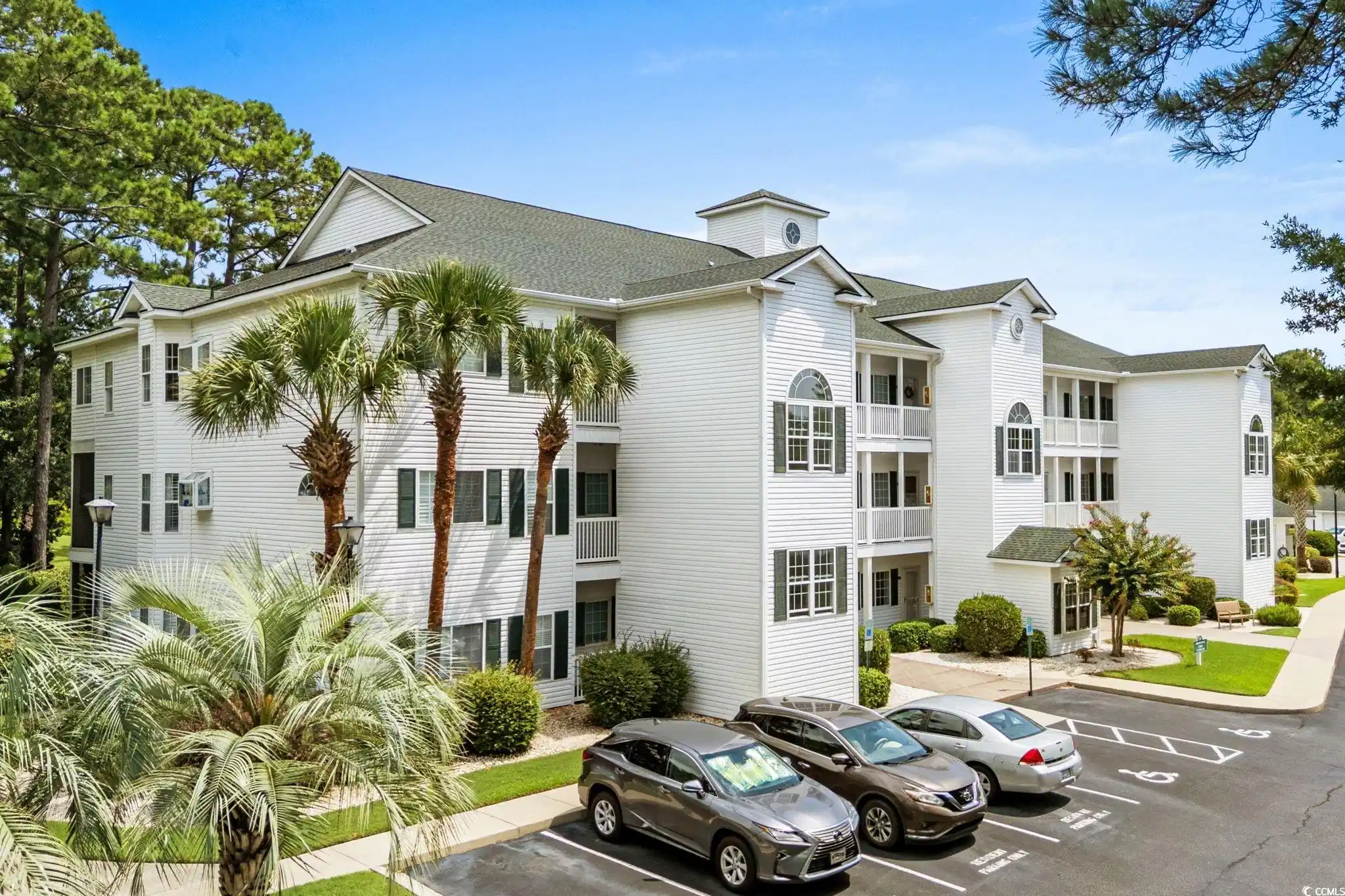 Image 1: View of property featuring uncovered parking