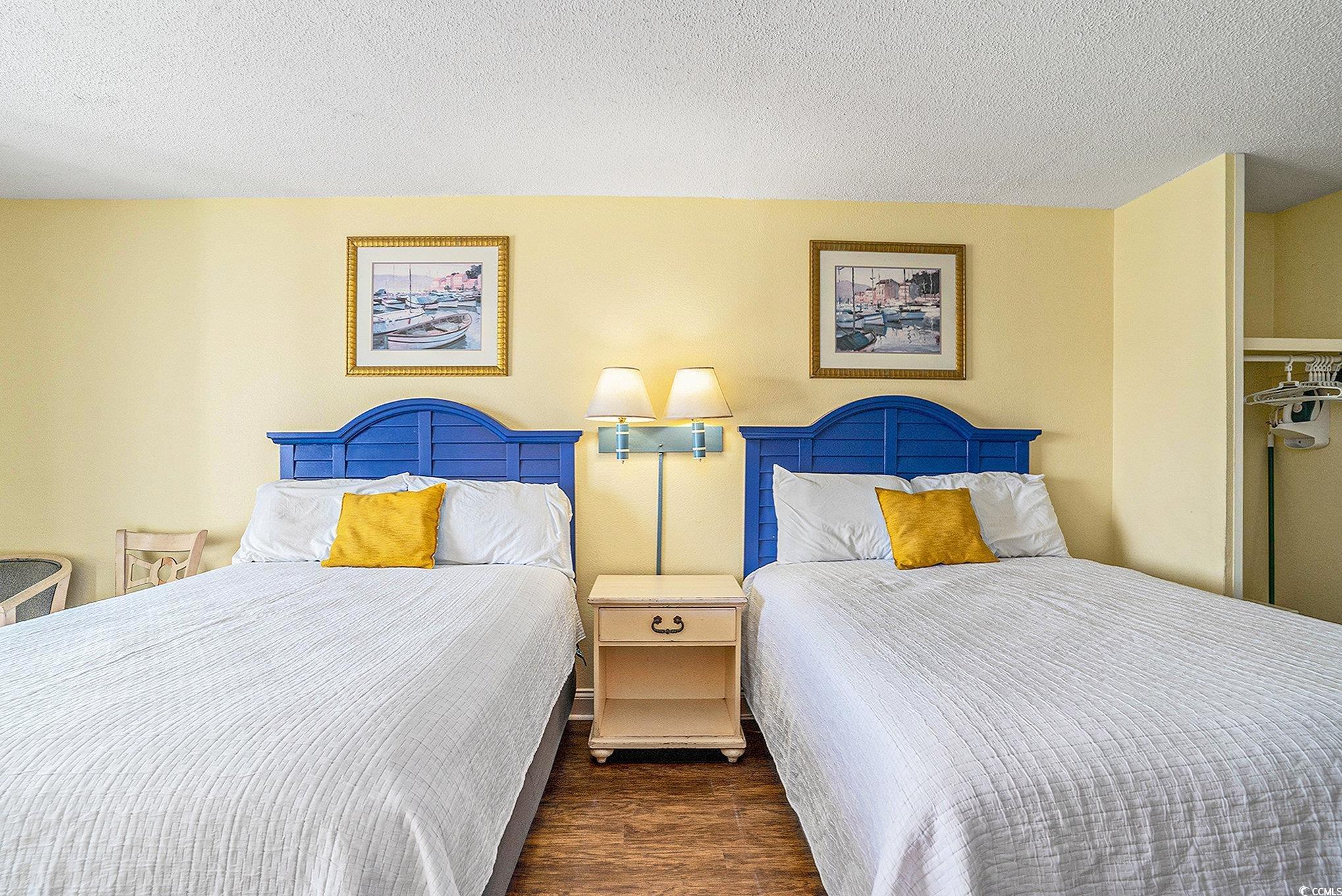 Image 3: Bedroom featuring a textured ceiling and dark wood Image 3: Bedroom featuring a textured ceiling and dark wood