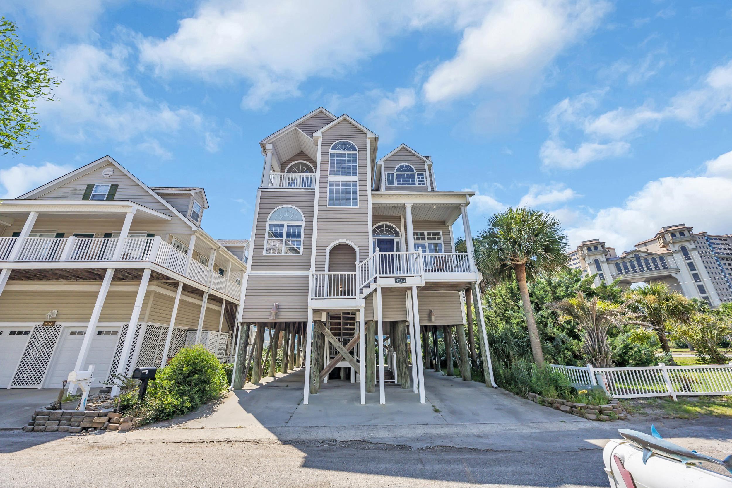 Image 3: View of front of property with a carport and drive