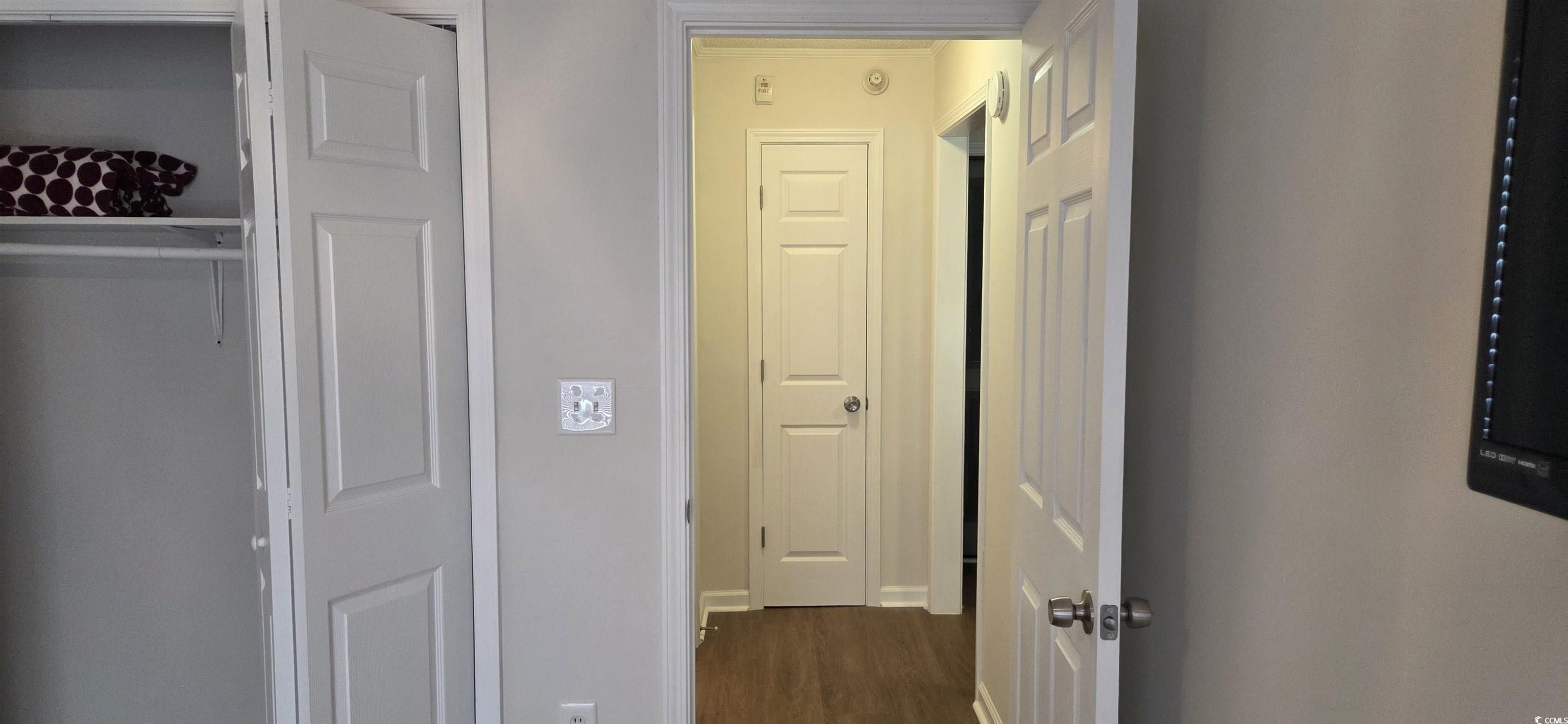 Image 4: Corridor featuring dark wood-style floors and base Image 4: Corridor featuring dark wood-style floors and base