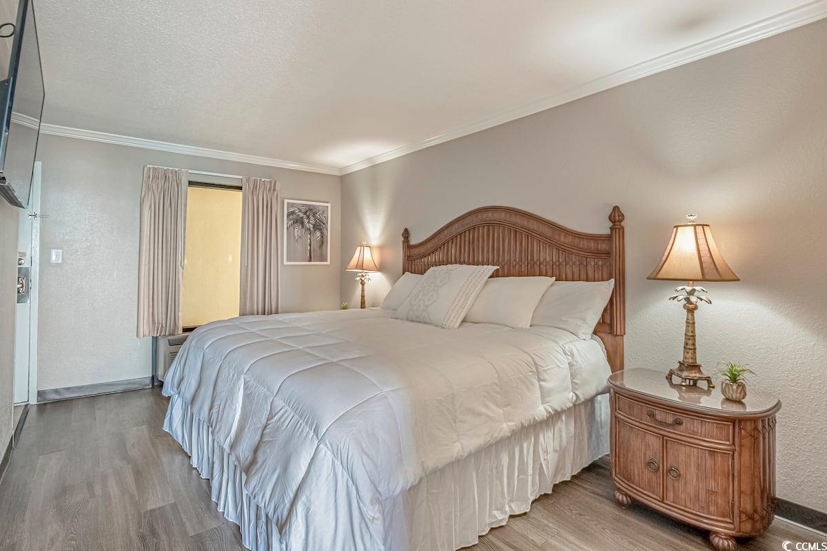 Image 3: Bedroom with ornamental molding, wood finished flo Image 3: Bedroom with ornamental molding, wood finished flo