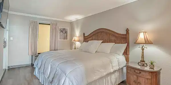 Image 3: Bedroom with ornamental molding, wood finished flo