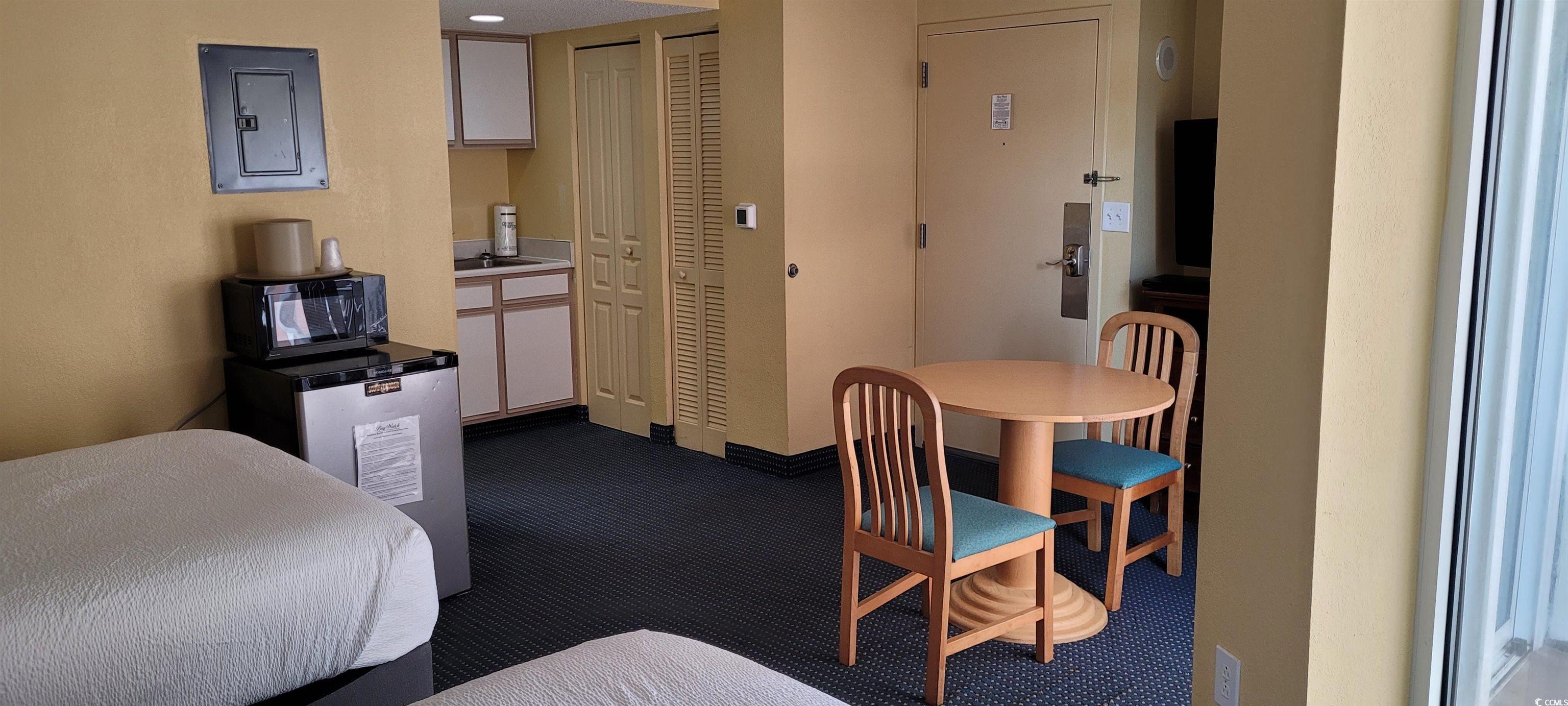 Image 4: Bedroom featuring a closet and dark colored carpet