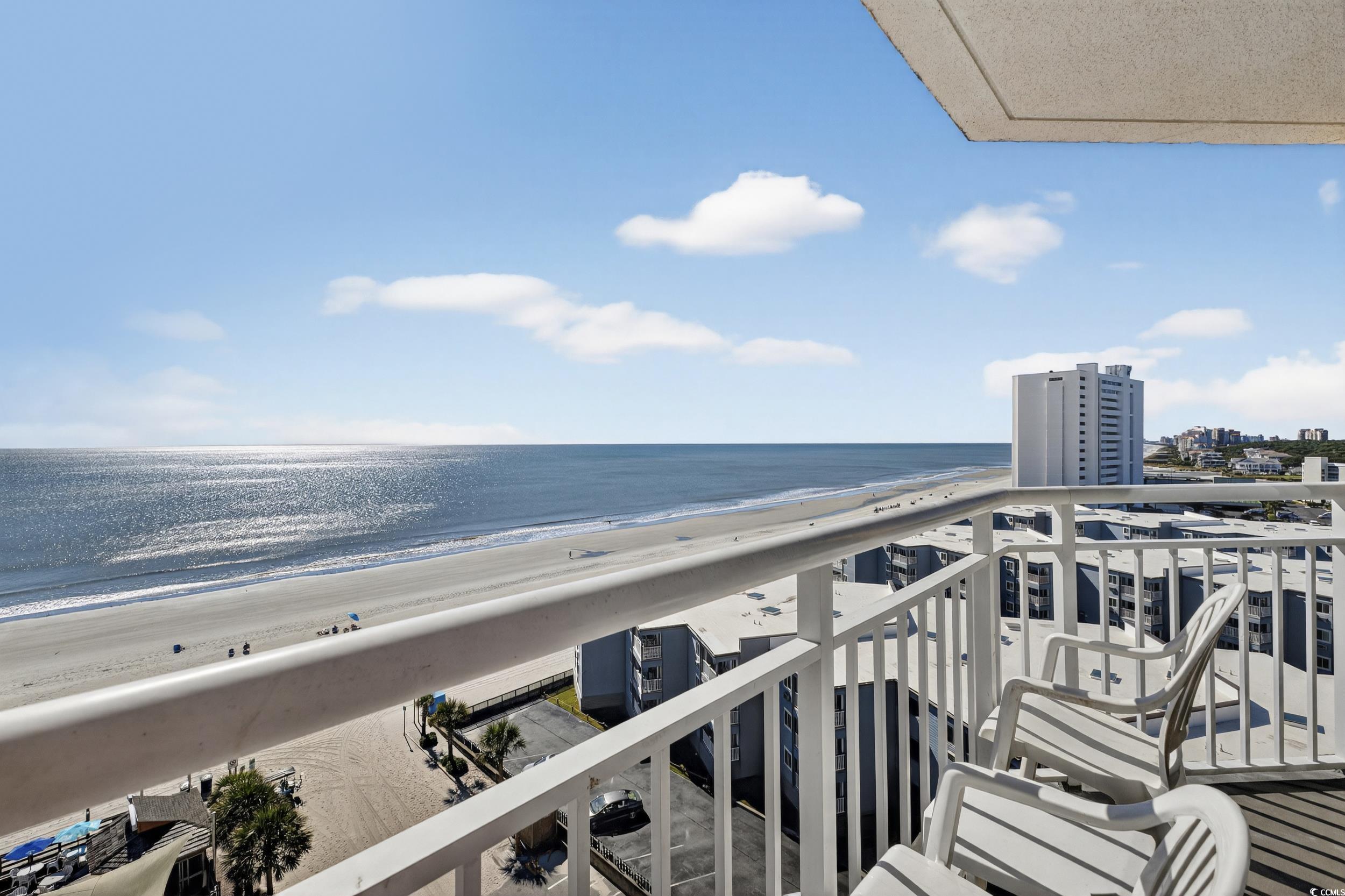 Image 2: Balcony with view of water and beach - end unit! Image 2: Balcony with view of water and beach - end unit!