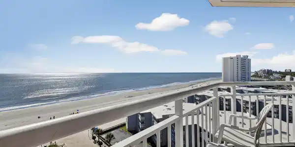 Image 2: Balcony with view of water and beach - end unit!