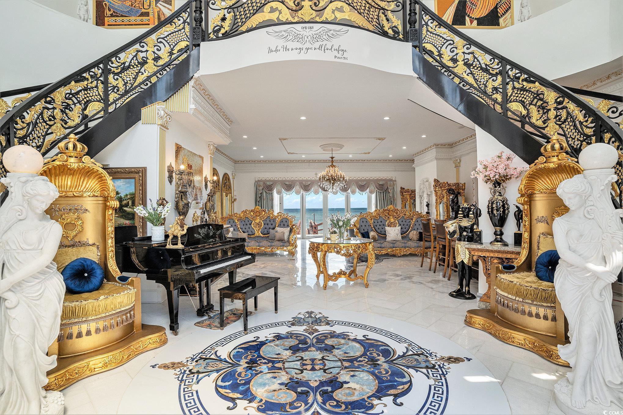 Image 3: Foyer featuring stairs, crown molding, and a tower