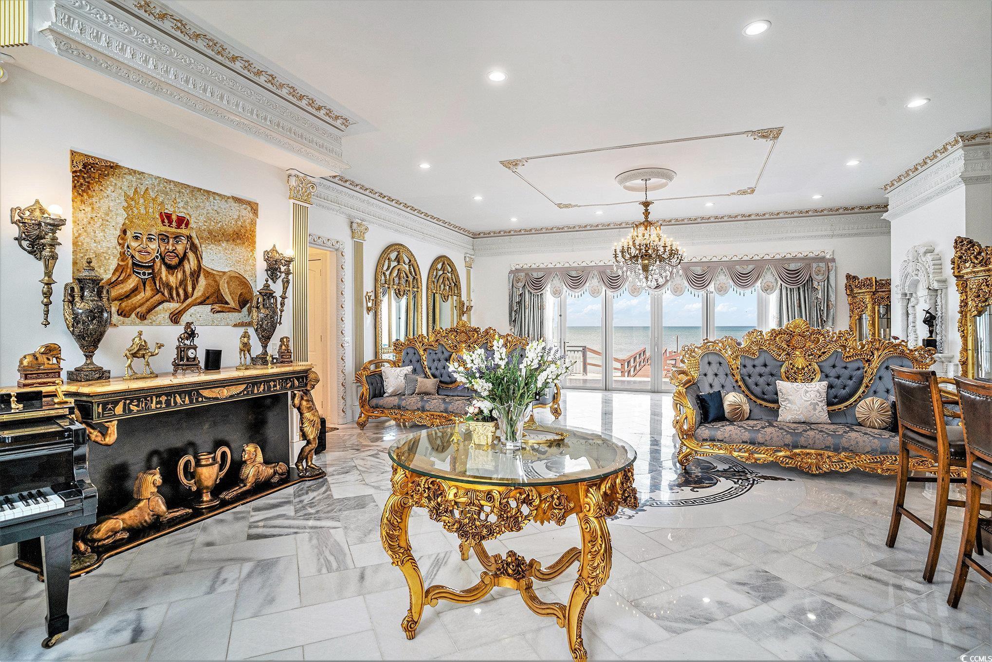 Image 4: Living room with marble finish floors, crown moldi