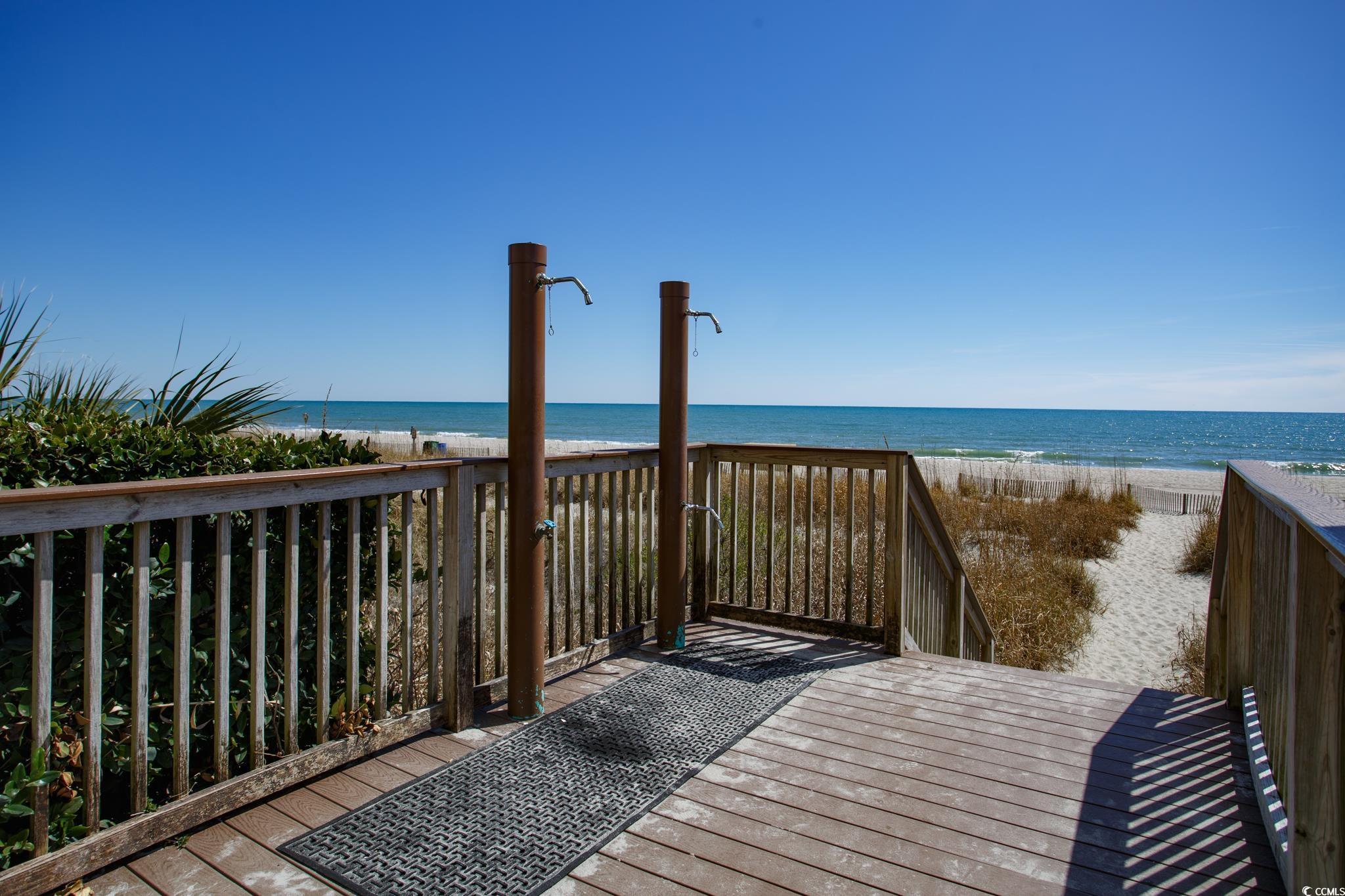 Image 3: Surrounding community with a view of the beach and Image 3: Surrounding community with a view of the beach and