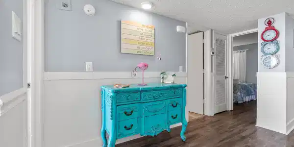 Image 4: Hall featuring wainscoting, a textured ceiling, an Image 4: Hall featuring wainscoting, a textured ceiling, an