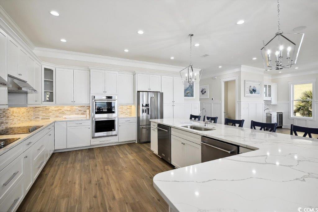 Image 3: Kitchen with white cabinets, hanging light fixture Image 3: Kitchen with white cabinets, hanging light fixture