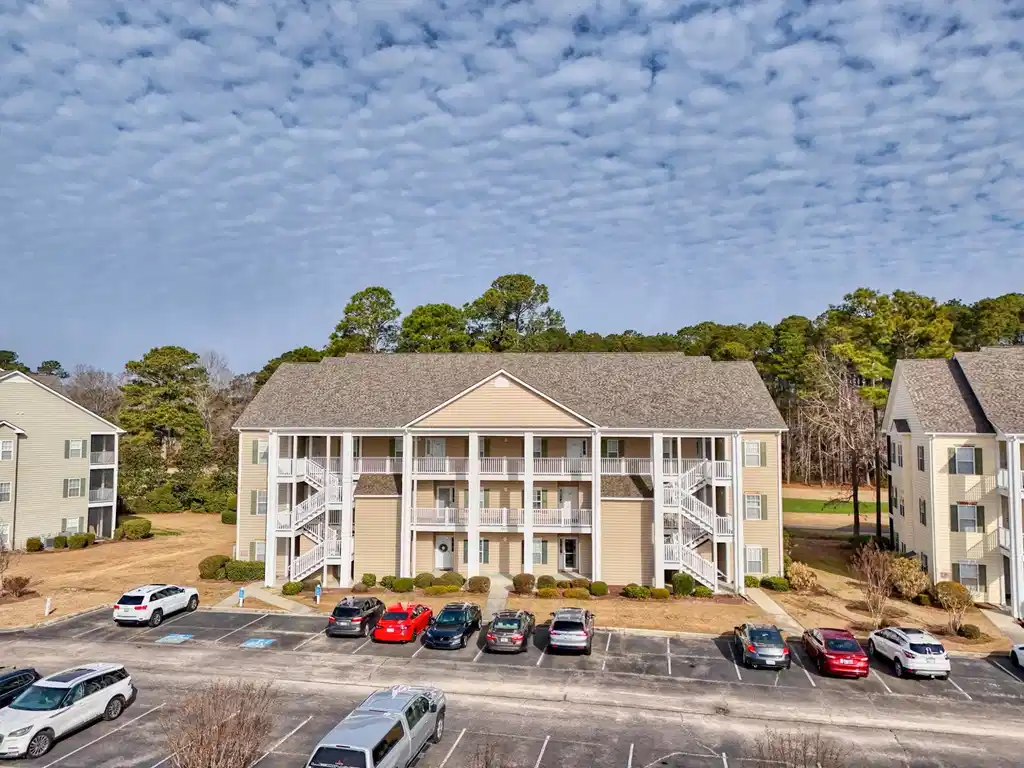 Image 1: Three-story building, new roof installed in 2025,