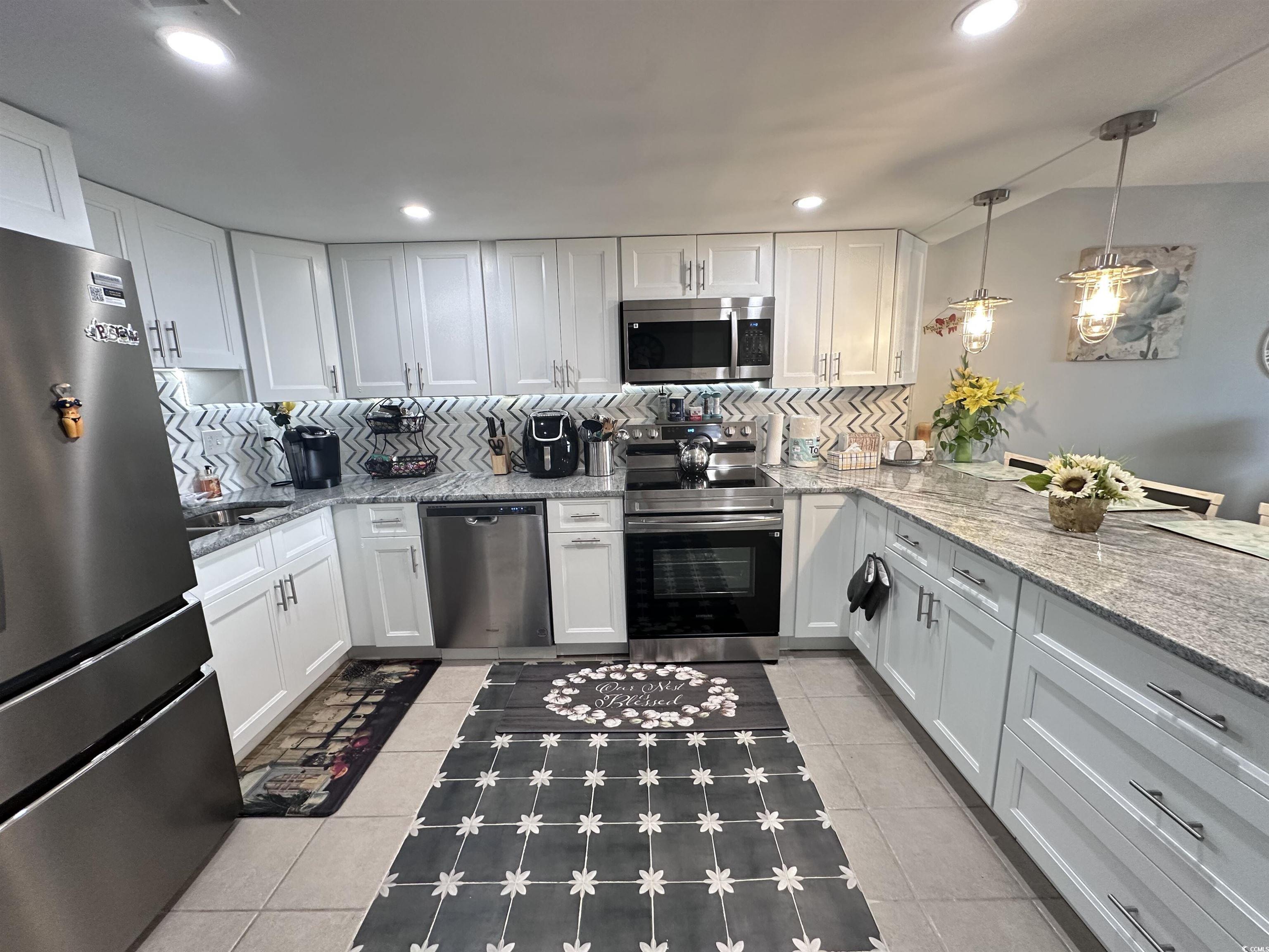 Image 3: Kitchen featuring decorative backsplash, appliance Image 3: Kitchen featuring decorative backsplash, appliance