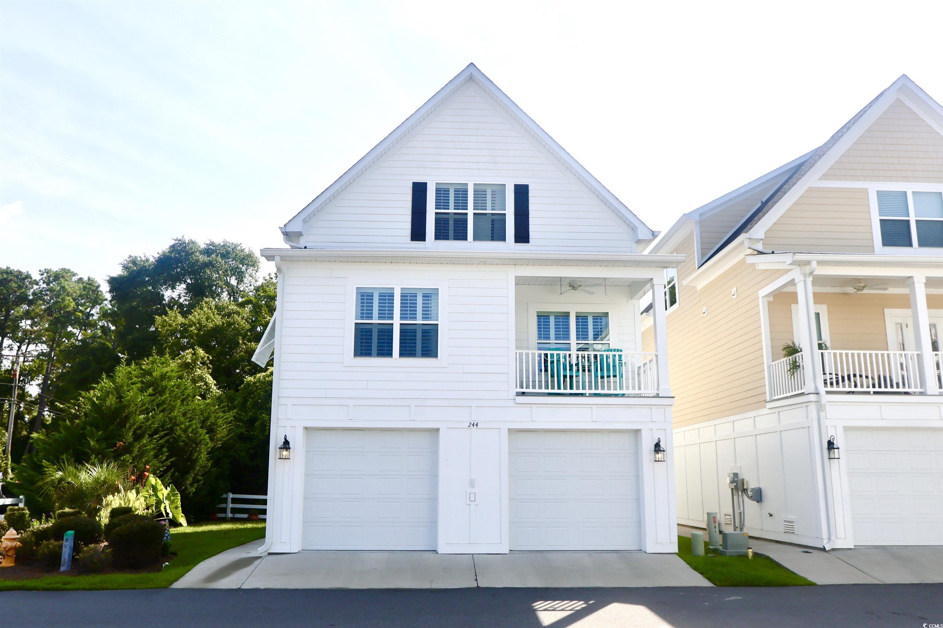 Image 1: View of front of property with an attached garage,