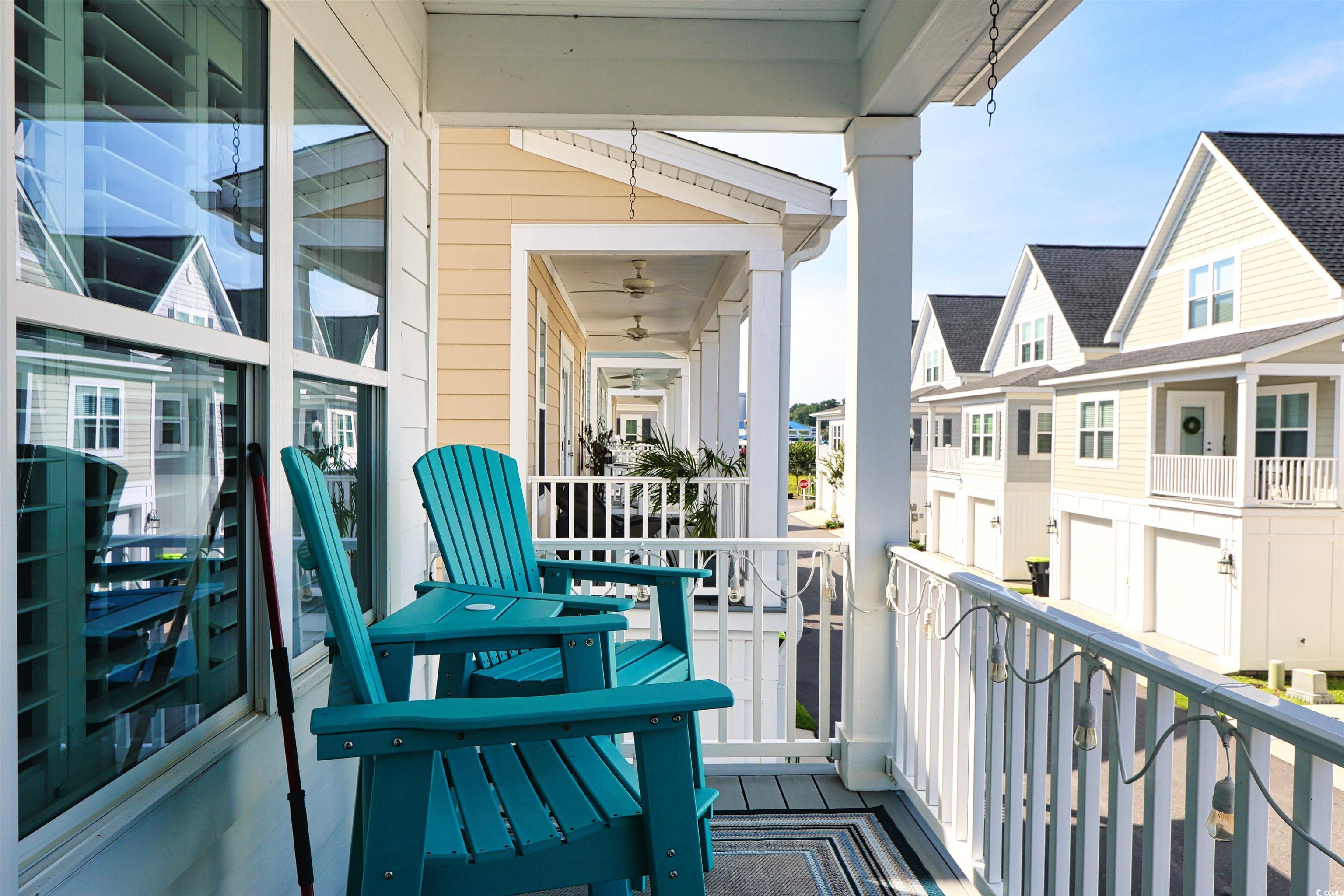 Image 2: Balcony featuring a residential view