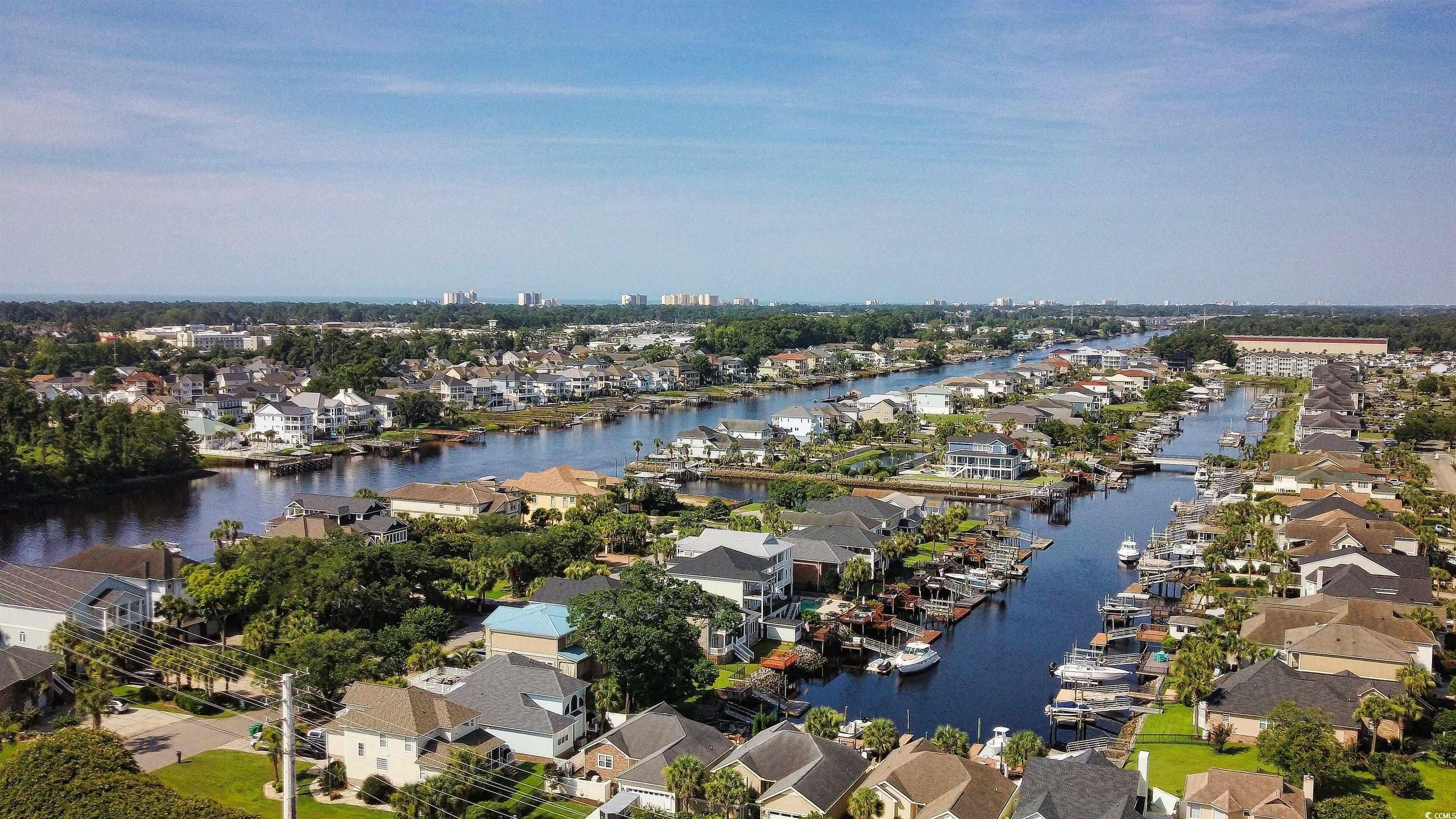 Image 3: Aerial perspective of suburban area with a large b