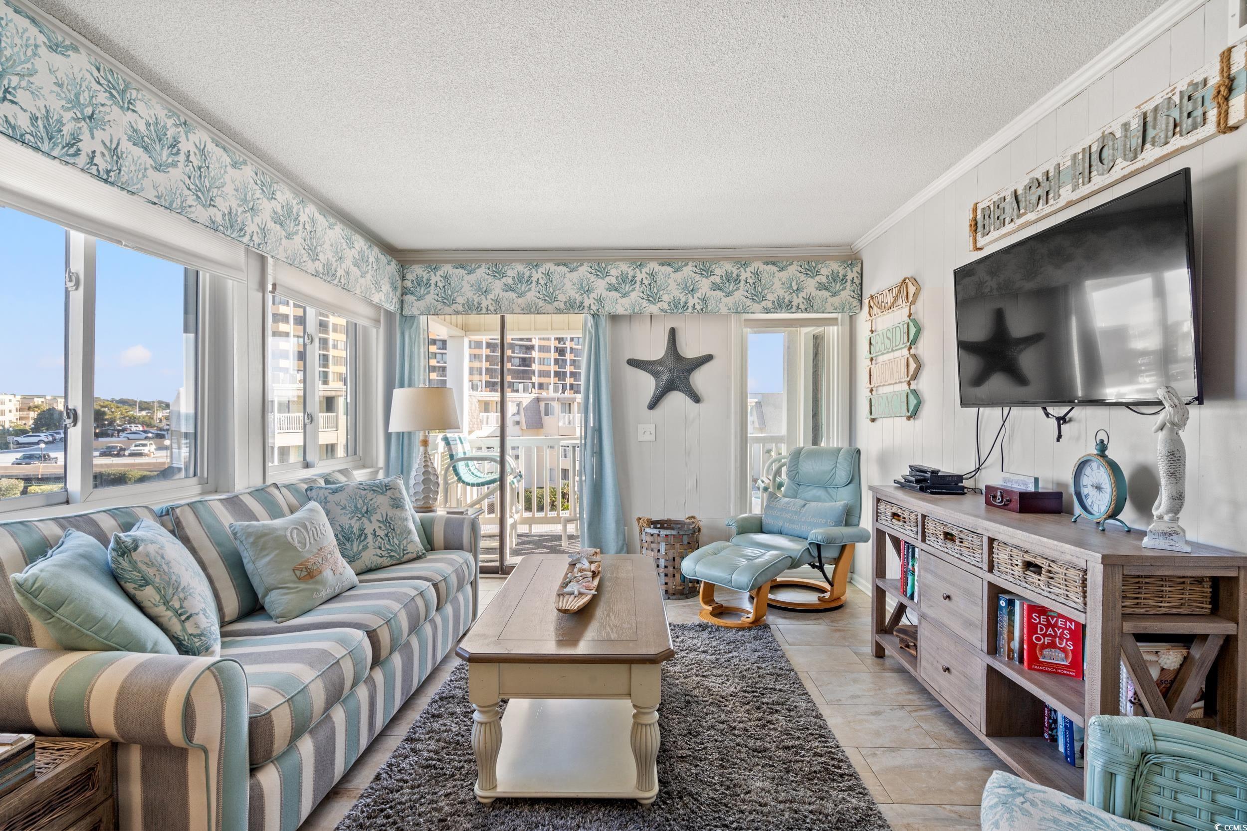 Image 2: Living room with a textured ceiling and crown mold Image 2: Living room with a textured ceiling and crown mold