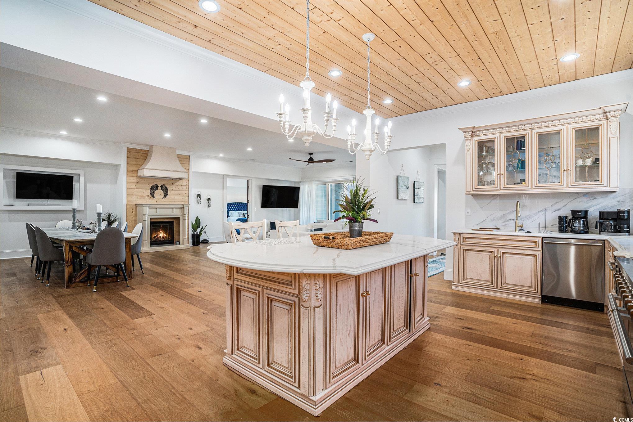 Image 4: Kitchen with dishwasher, open floor plan, hardwood