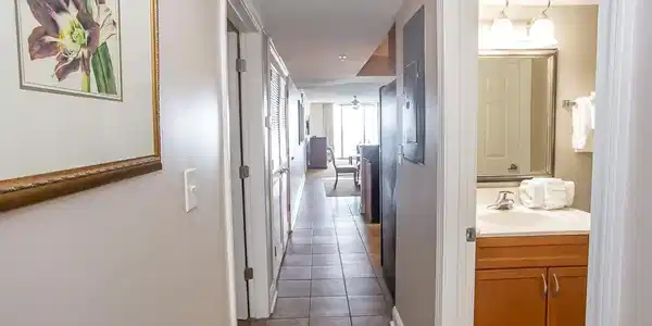 Image 4: Hallway with light tile patterned flooring and sin Image 4: Hallway with light tile patterned flooring and sin