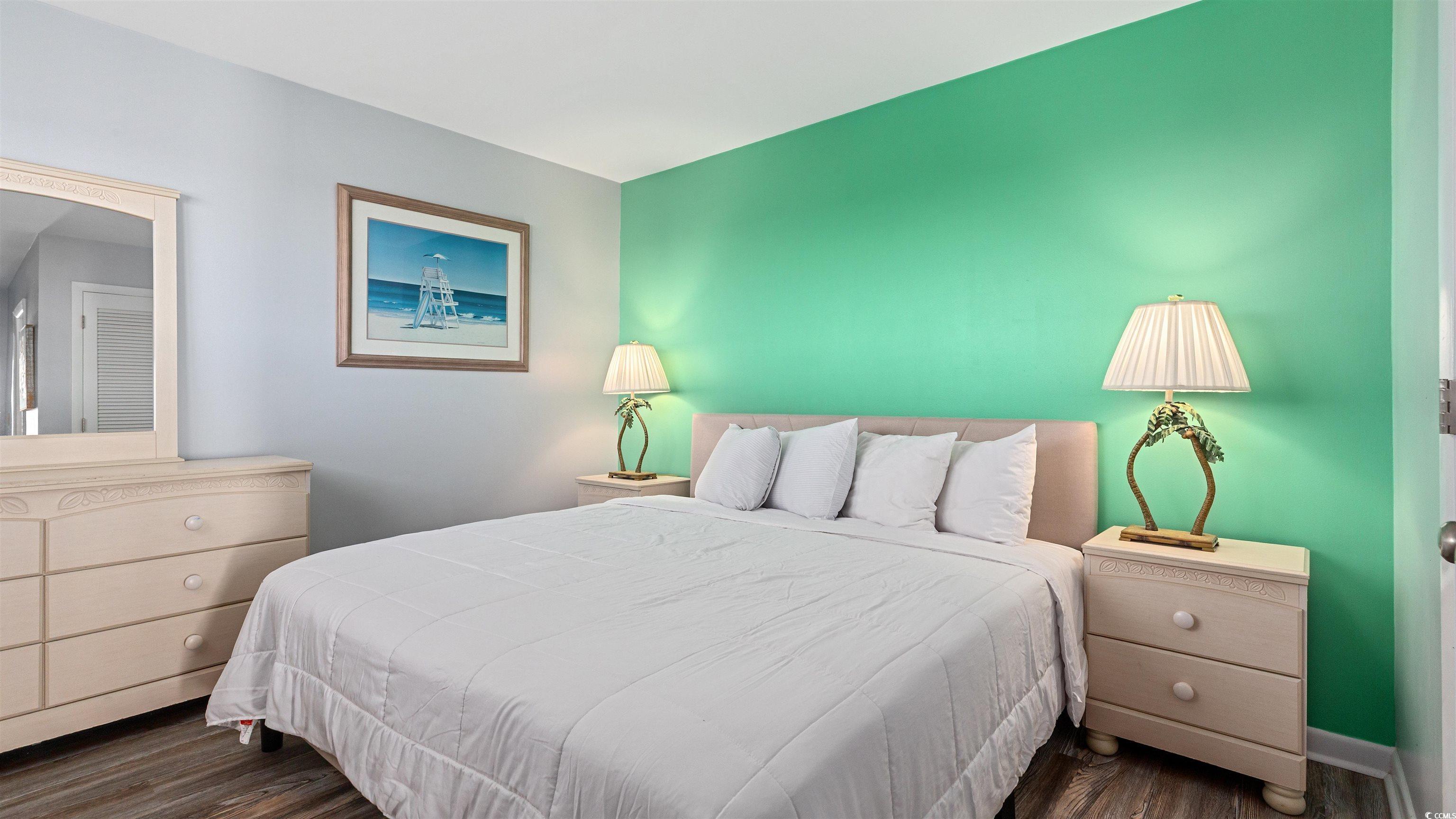 Image 4: Bedroom featuring dark wood-style flooring Image 4: Bedroom featuring dark wood-style flooring