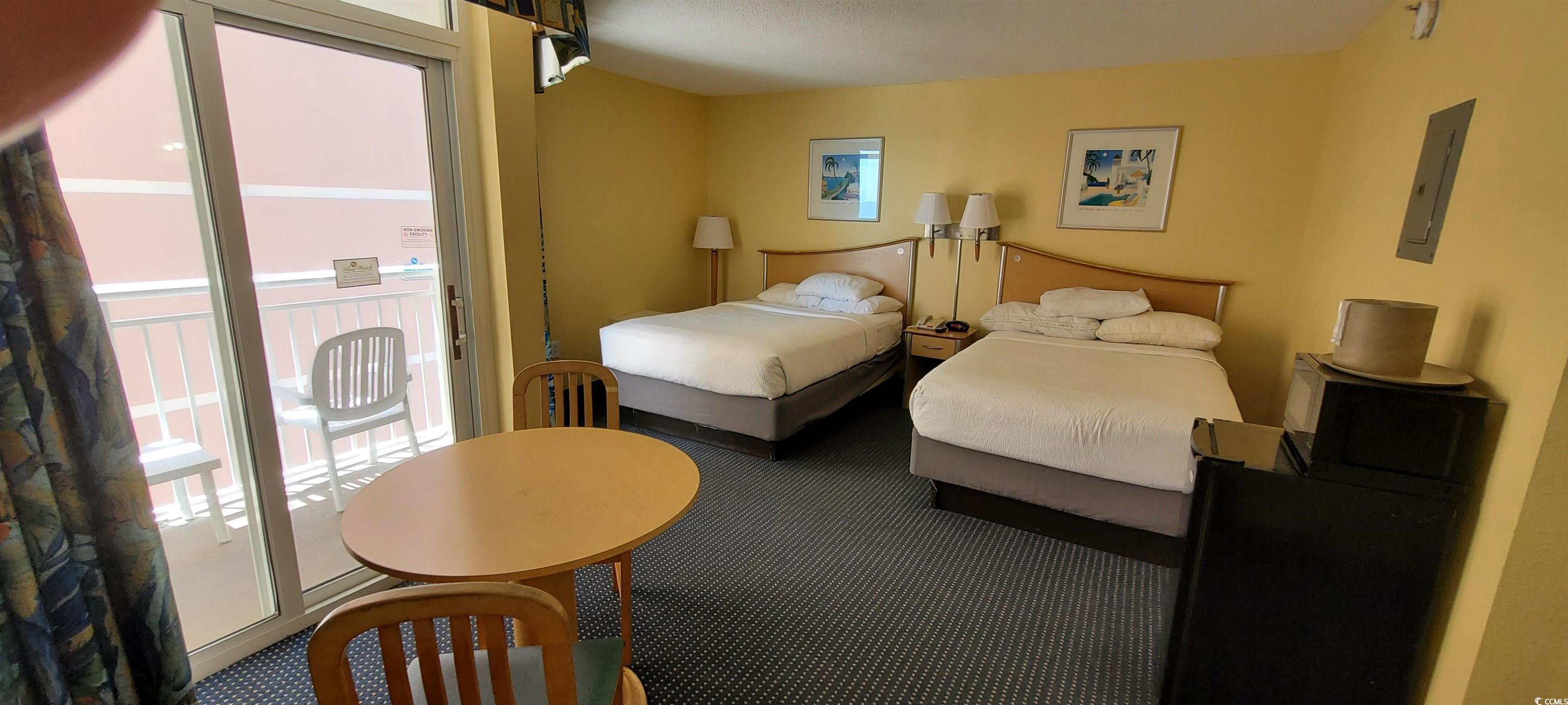Image 2: Carpeted bedroom featuring access to outside, elec Image 2: Carpeted bedroom featuring access to outside, elec