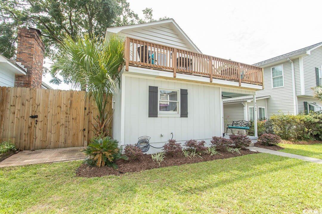 Image 2: View of front of property with a front lawn, board Image 2: View of front of property with a front lawn, board