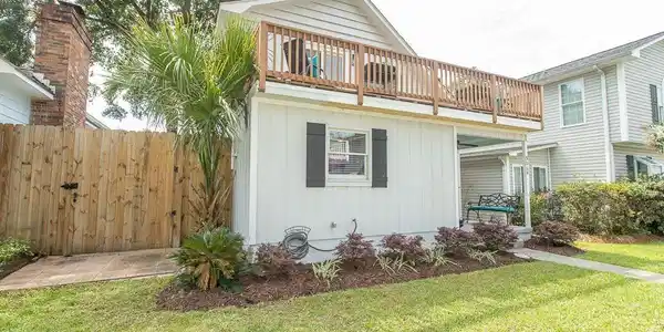 Image 2: View of front of property with a front lawn, board Image 2: View of front of property with a front lawn, board